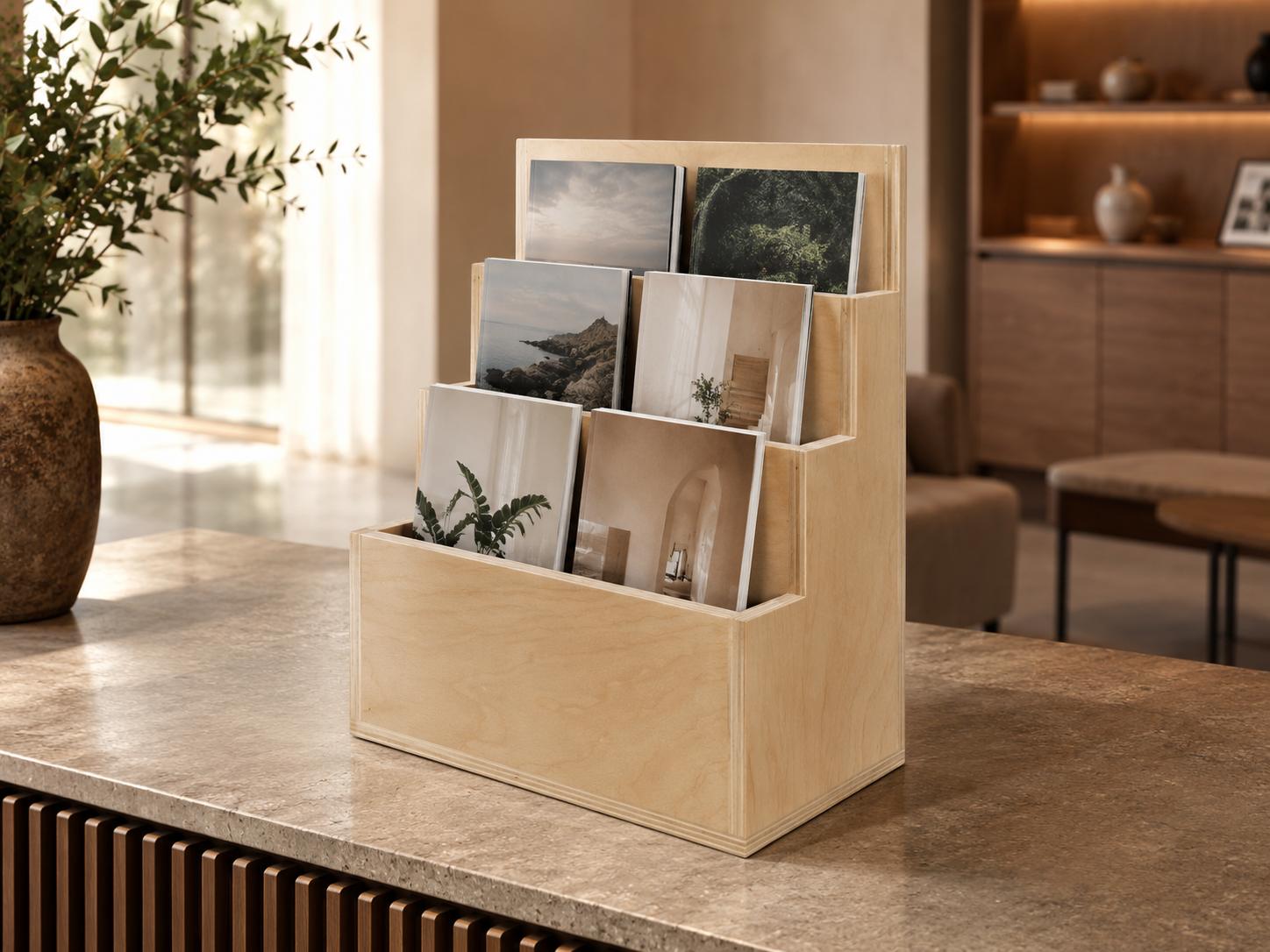 The Neesh magazine stand on a counter, four titles face out