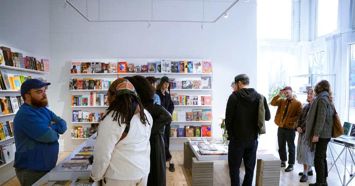 People browsing the magazine shelves in a shop
